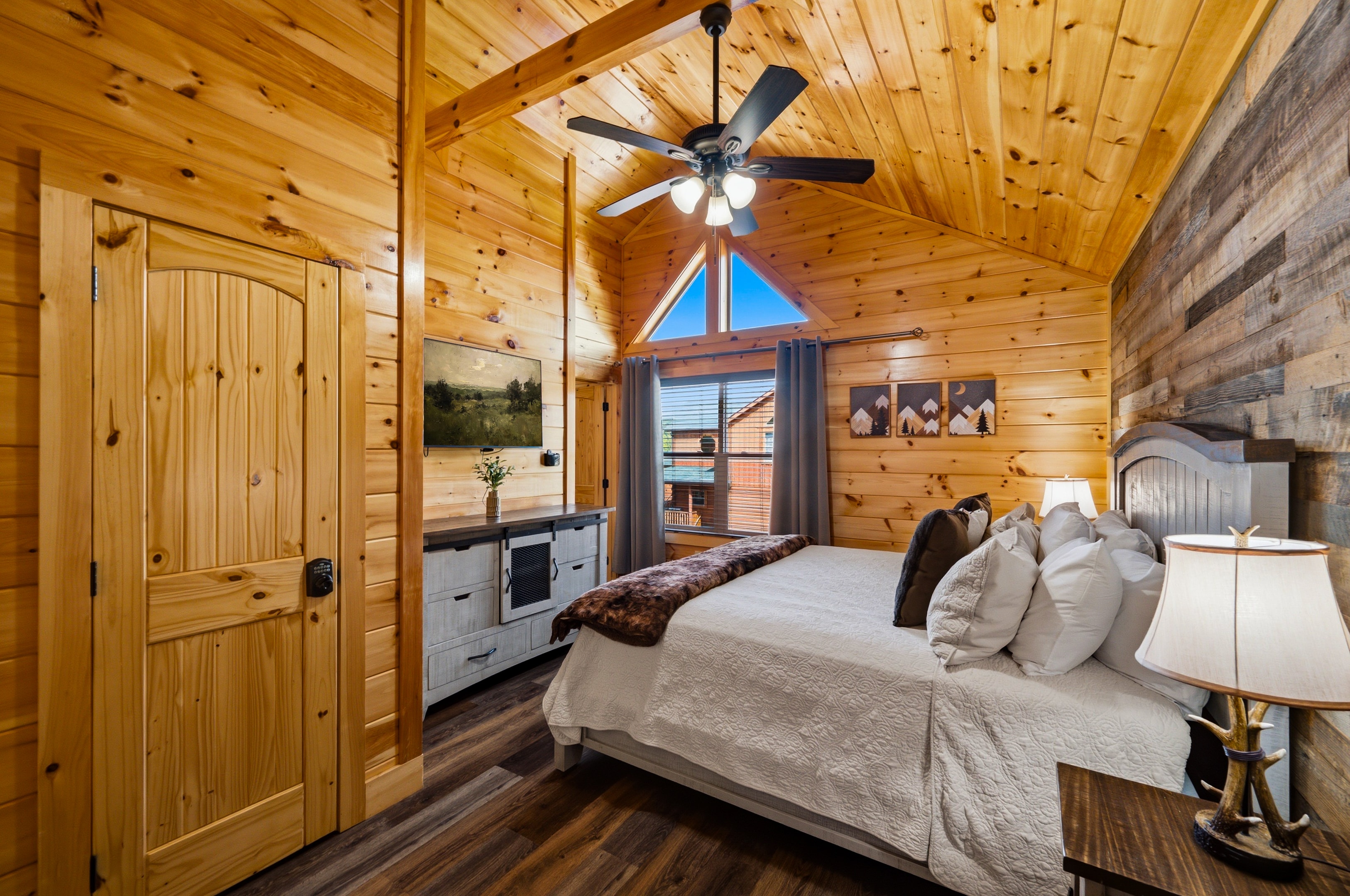King bedroom with wood wall accent